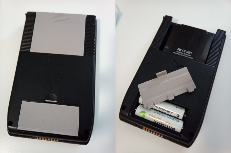 Handspring Visor PDA face-down, showing replacement battery door and Springboard slot cover